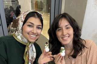 Zahra and Grace felting snowmen
